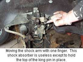 front shock absorber with floppy arm