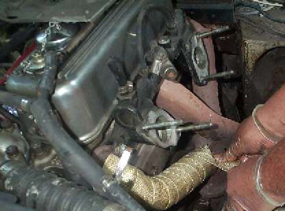 Wrapping the tape on the exhaust manifold