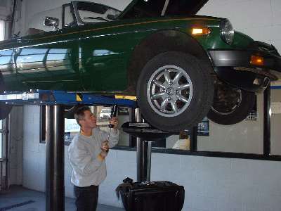 worker under MGB on lift