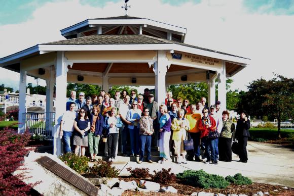 Participants of the 10th Annual Wine, Cheese and Beer Tour pose in the gazebo in Port Chicago marina.