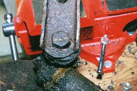 Close up of bolt and worn a-arm