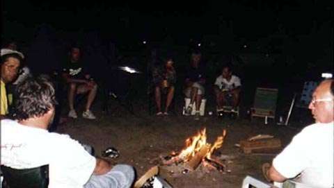 Club members around the campfire
