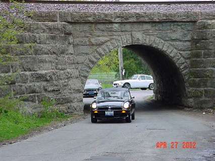 MGs passing under old rail road bridge