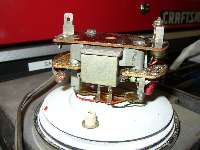 circuit board isolated from metal frame with insulating washers