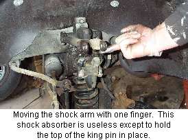front shock absorber with floppy arm