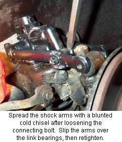 prying apart chock arm