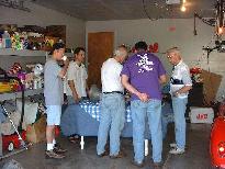 Crowd around table with gearbox